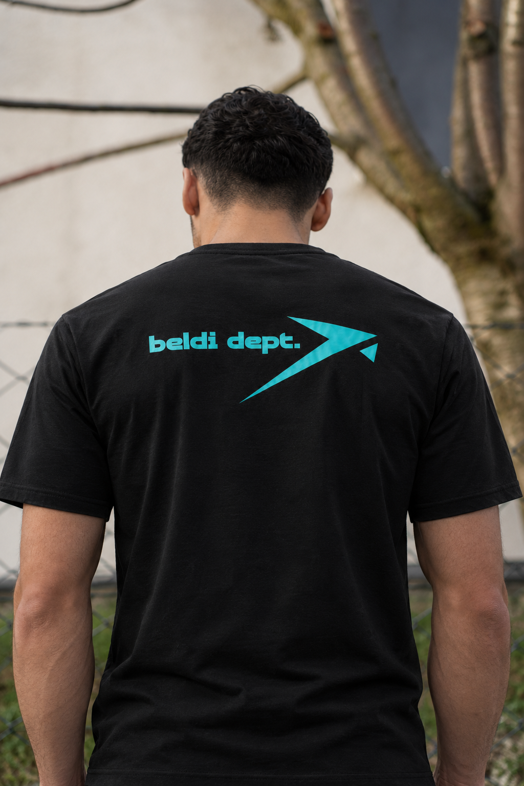 Street portrait in the black Beldi Dept. Performance T-Shirt